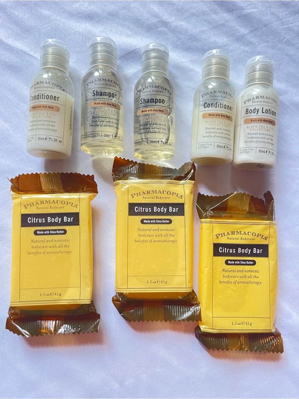 Pharmacopeia citrus body bar, shampoo, conditioner & body lotion.